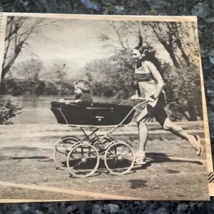 Bjorg Austrheim-Smith pushing her child in a stroller while listening to music. 